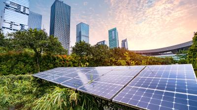 Solar panels in field in city