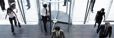 Building entrance with people coming in and out